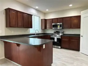 Large kitchen with plenty of cook space along with Peninsula eating area for additional seating.