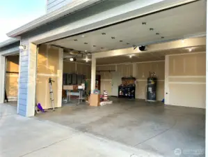 Garage with man door to the back yard makes working on projects easy and convenient!