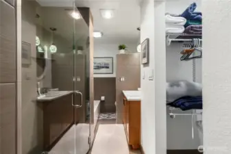 The primary bedroom boasts a spa-like bathroom and a walk-in closet.