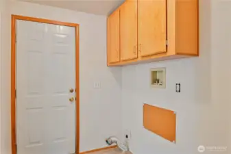 Laundry room with door to large back deck