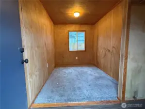 Enclosed storage room off of garage