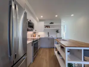 Open kitchen with stainless appliances
