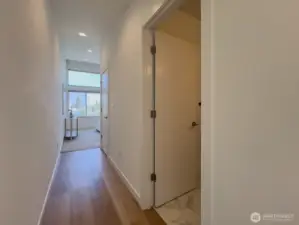 Laundry and bath tucked around the corner from bedroom