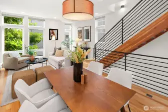 Open concept living/dining/kitchen w/ gas fireplace & floor to ceiling windows