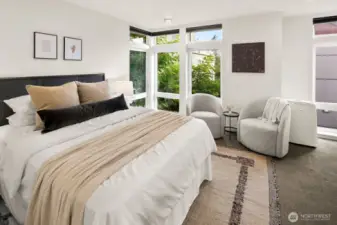 Upper level primary suite w/ walk-in closet & expansive en-suite bath