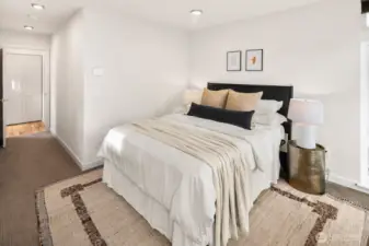 Upper level primary suite w/ walk-in closet & expansive en-suite bath