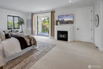 Owner's retreat with a spa-inspired bath, spacious walk-in closet and a cozy gas fireplace for added ambiance. Enjoy sunsets from the serene view deck.