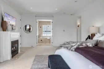 Owner's retreat with a spa-inspired bath, spacious walk-in closet and a cozy gas fireplace for added ambiance. Enjoy sunsets from the serene view deck.