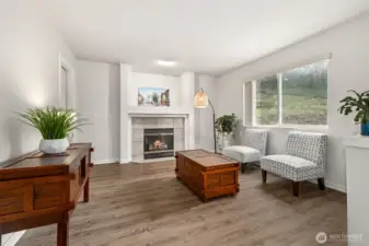 Lovely family room with gas fireplace and luxury vinyl plank flooring