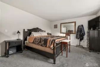 Primary bedroom with King-size bed.