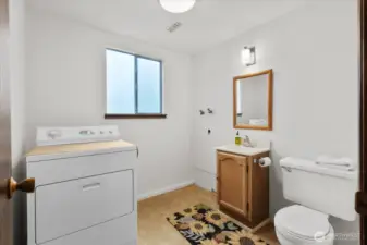 Lower level half bath with laundry.