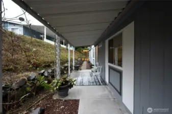 Gorgeous landscaping, rock patio and covered deck.