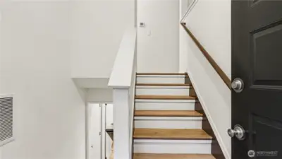 Home enters to split entry, upstairs offers main living area, downstairs takes you to two guest bedrooms.