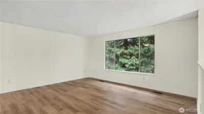 Upstairs living room filled with natural light, perfect for relaxing or entertaining.