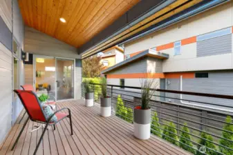Covered deck has access to primary bedroom, as well as the loft straight ahead