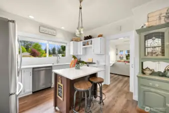 Bright windows in the kitchen overlooking the beautiful sideyard.