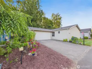This lovingly maintained home is waiting for its new owner. Prettily landscaped yard.