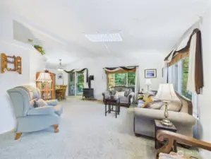 The roomy living room welcomes you into this bright home.