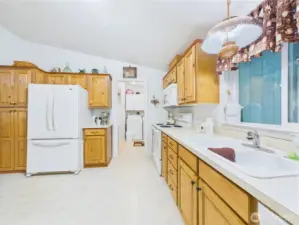 You can do the dishes with a view of the pretty back yard.