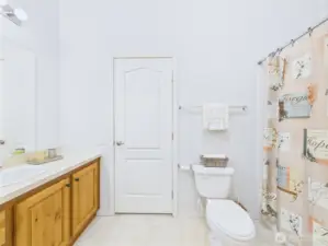 The full guest bathroom is conveniently located in the middle of the home.