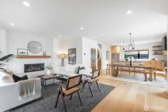 Comfortable living room complete with custom mantle-piece and convenient gas fireplace. LED lighting. New interior paint.