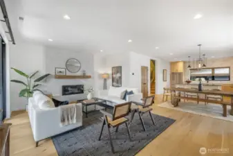 Comfortable living room complete with custom mantle-piece and convenient gas fireplace. Custom mantle piece. LED lighting. New interior paint.