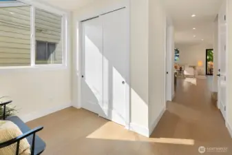 The entry access the main living area of the home. As you enter, there's extra space and a storage closet.