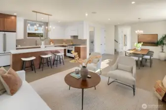 The kitchen blends the warmth of wood with the white/gold appliances. Designed for open entertaining, the kitchen island is expansive.