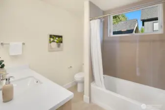 The 2 additional bedrooms on the second level of the home share this full bath.