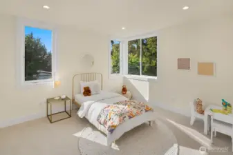 One of two additional bedrooms on the second level of the home.