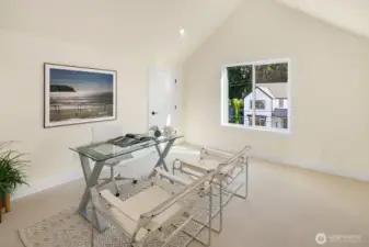 This is a 4th bedroom on the top level of the home. It is staged here as an office. there are two long closets on either side of the room for tons of storage space.