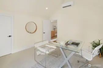 This is the 4th bedroom on the top level of the home, currently staged as an office.