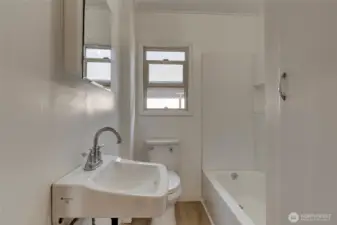 unit 102 remodeled bathroom with shower & tub
