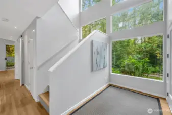 Entering the newly painted interior, one is struck by the two-story, sunny entrance. Hardwood floors flow thru out the home