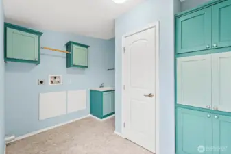Utility Room with plenty of storage and a sink!