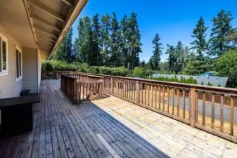 Large 2nd story deck with concrete patio below