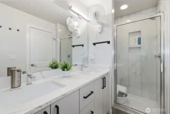 Third Level: Primary 3/4 bath with his & her sink