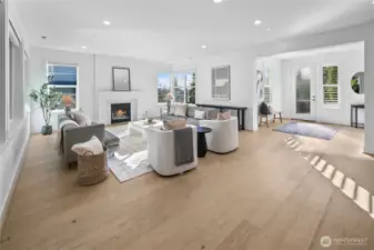 Sun-soaked great room with cozy gas fire place