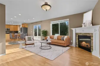Great room with fireplace and door to rear deck