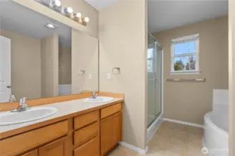 Dual vanity primary ensuite with large soaker tub.