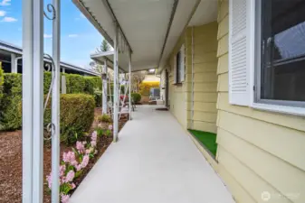 Stroll up the flower lined path to the front entry!