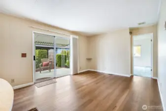 Wonderful natural light comes through the sliding door on to the newer LVP flooring.