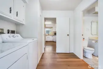 The utility room has extra storage and a washer and dryer that stay with the home.
