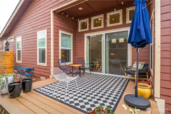 The large slider leads to an oversized Trex deck which expands the living space.  Very private outdoor living! SW exposure so fantastic orientation.