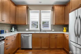 Window above the sink and custom window coverings. Top tier appliances.