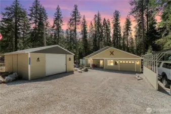 View of the enclosed carport that can fit 2 cars or several toys! Main house has attached one car garage with extra shop space!  Also included is additional carport for another car or more toys. Plenty of outside parking too!