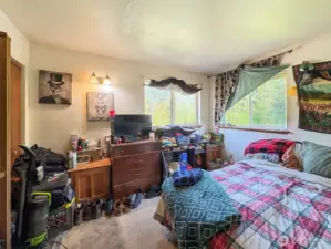 Upstairs bedroom with double closets to the left. King size bed.