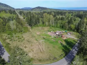 Another aerial view of the property. Fence line on the left part of fenced pasture for livestock.