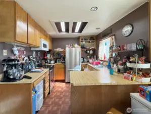 Nice U shaped kitchen with Window over the sink. Taken from the dining room.