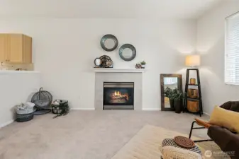 Cozy gas fireplace with an open floor plan feel.